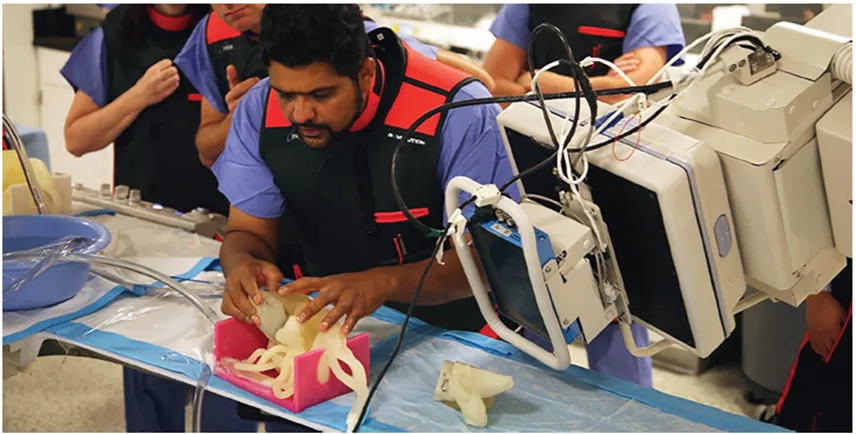 A surgeon uses a 3D printed heart model to test a mitral valve repair prior to treating the patient